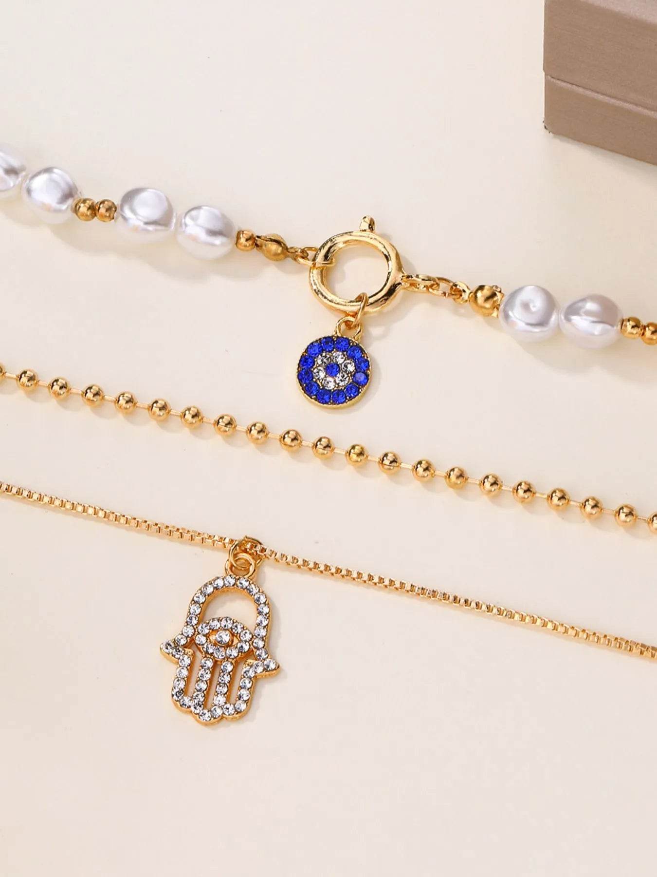 Layered Pearl Chain Evil Eye Hamsa Pendant Necklace - Tredona LLC